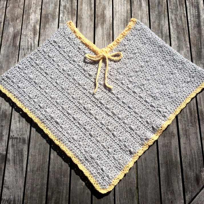 Poncho med bindebånd (2-8 år)